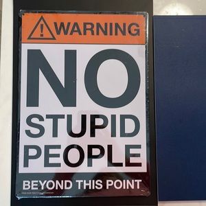 No Stupid People metal sign